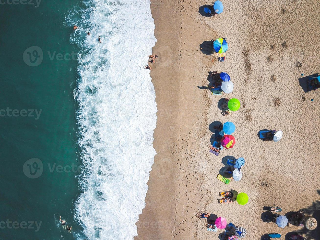 Beach with sun loungers on the coast of the ocean photo