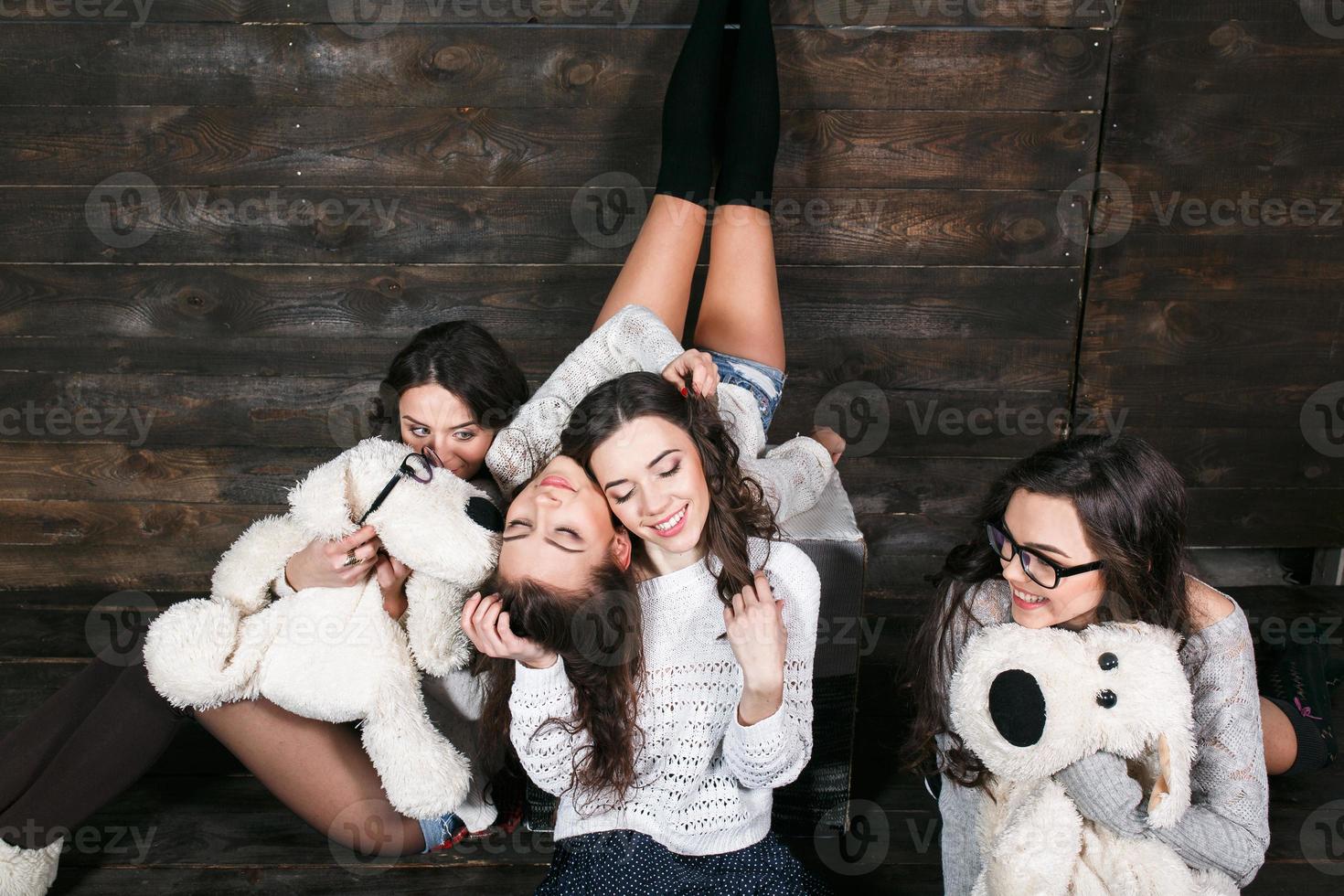 Four charming model posing on a vintage New Year's background photo