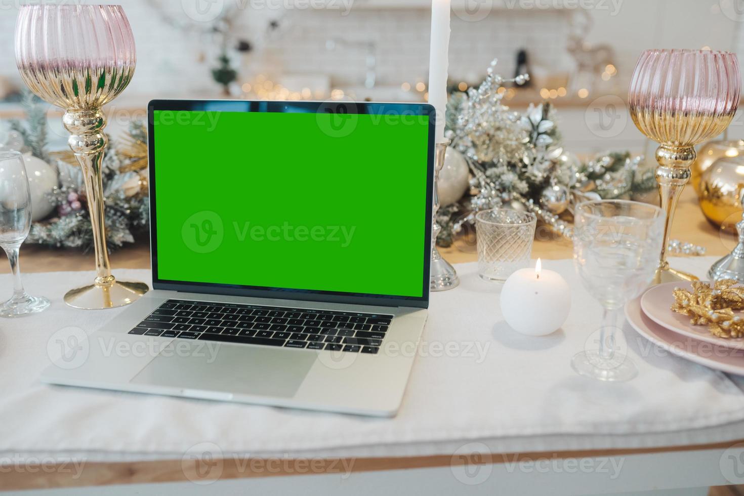 laptop with green screen - chromakey near New Year's decorations. christmas theme. photo