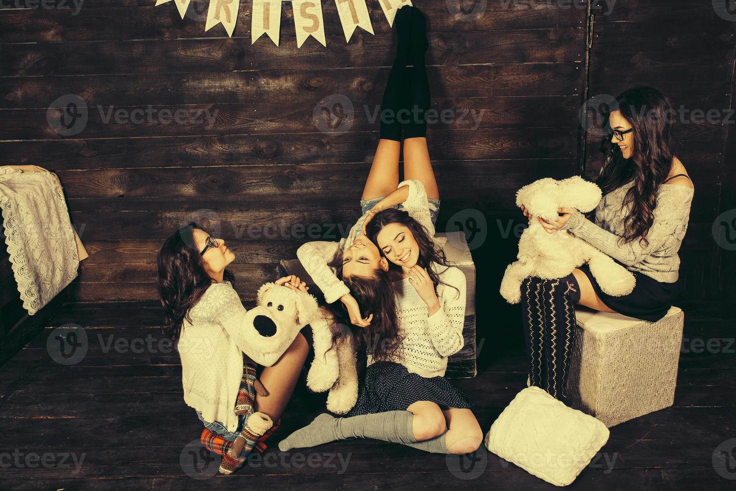 Four charming model posing on a vintage New Year's background photo