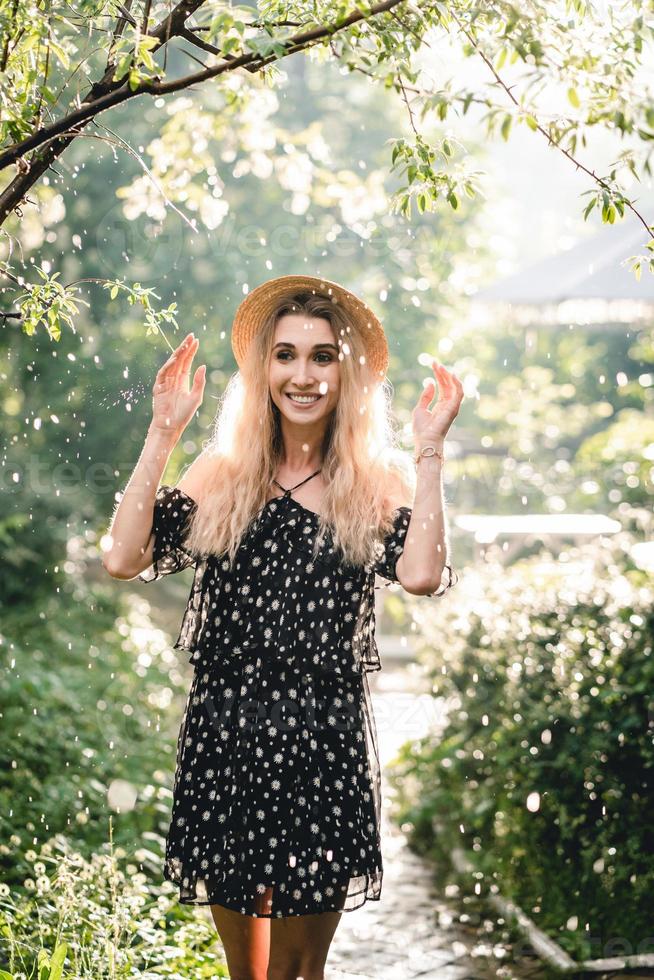 Girl in hat posing on camera photo