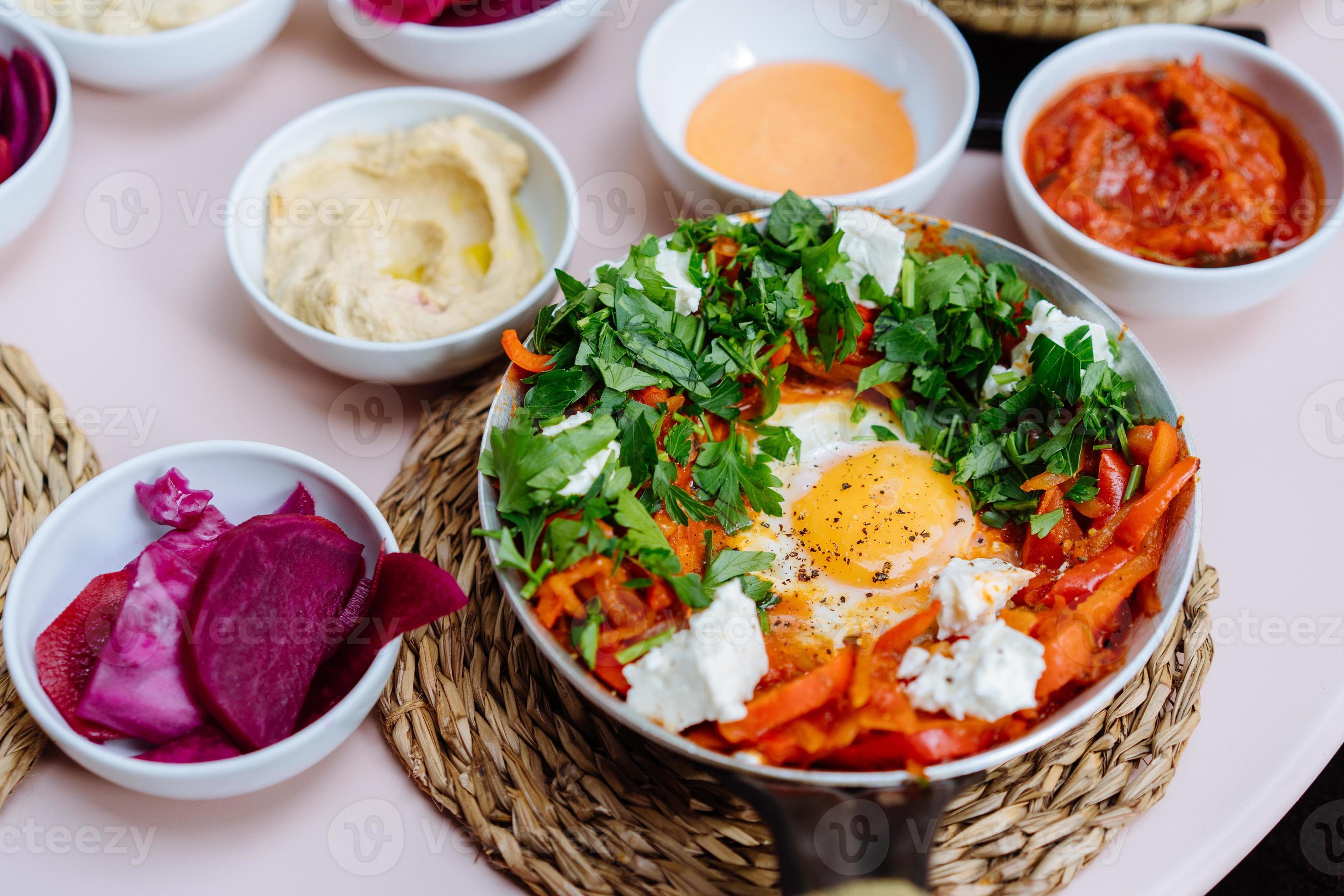 Shakshuka, Fried Eggs in Tomato Sauce on the Table 11522812 Stock Photo