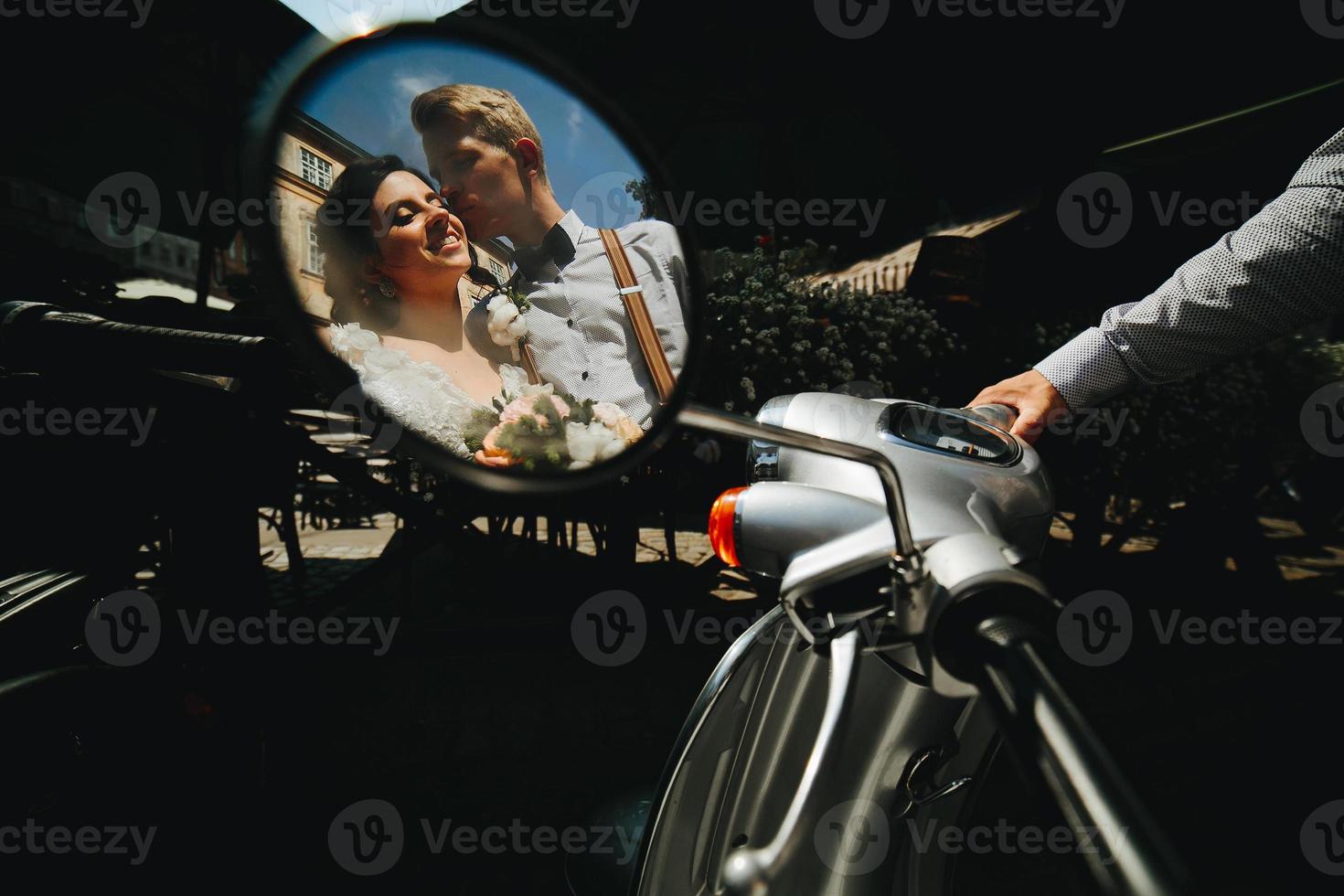 bride and groom in the mirror reflection photo