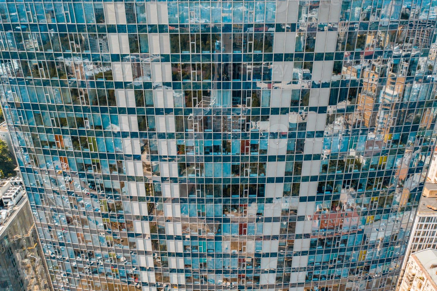 Street reflection on glass steel building facade photo