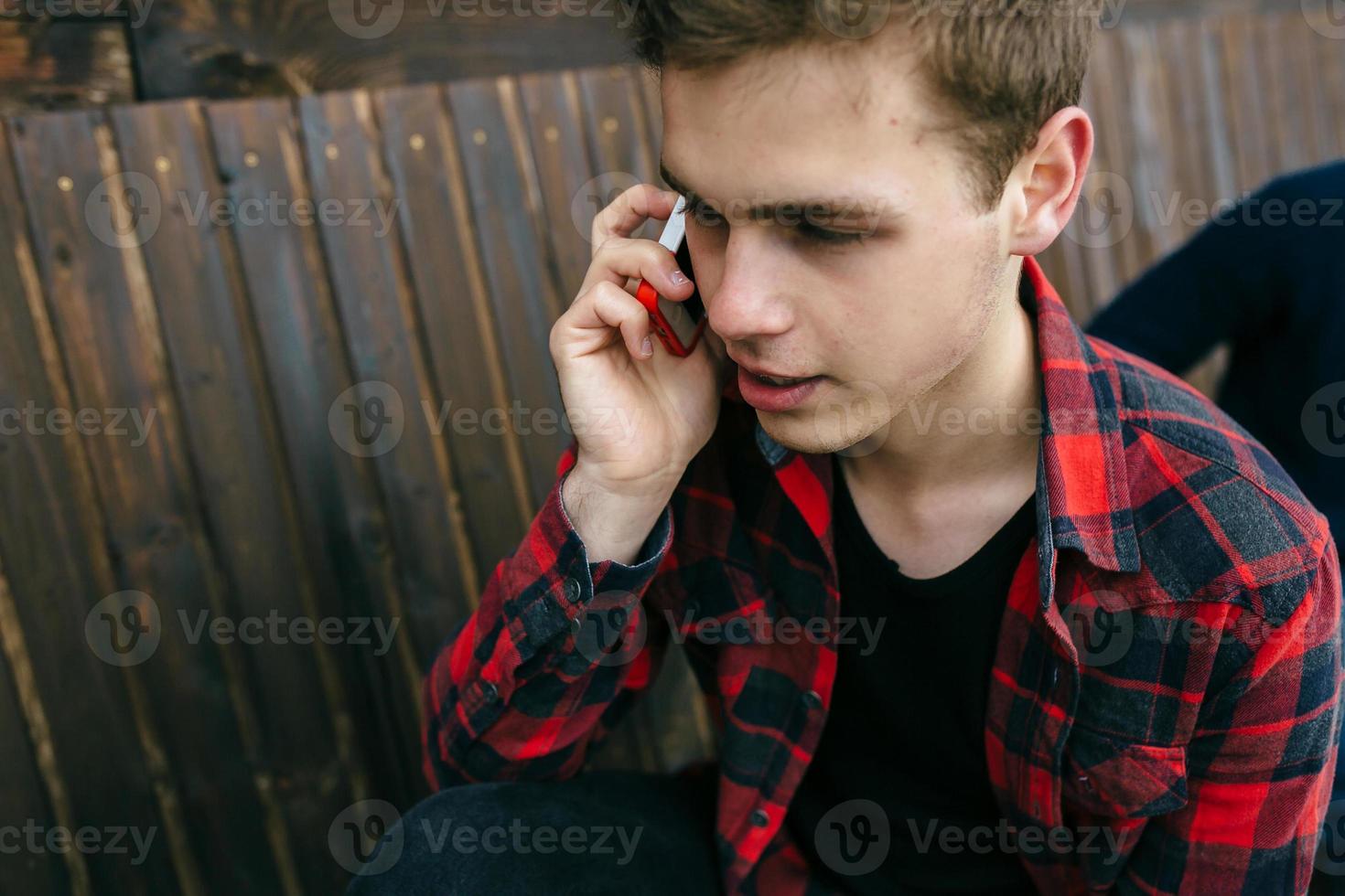 man talking on smartphone photo