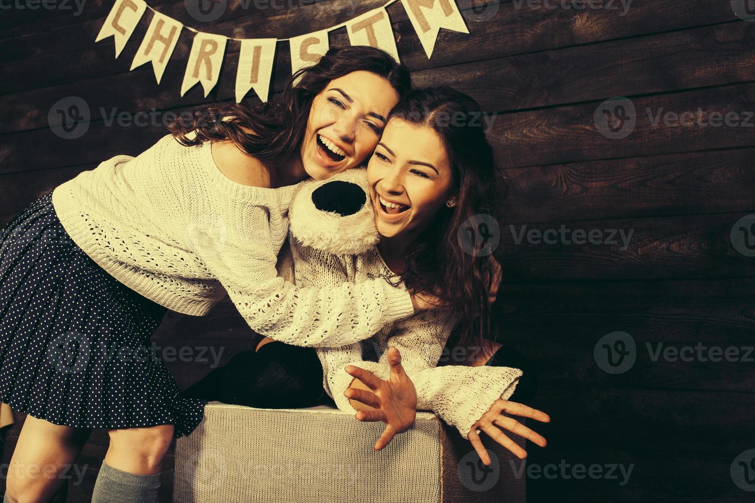 Family New Year's photos, one sister hugging each photo
