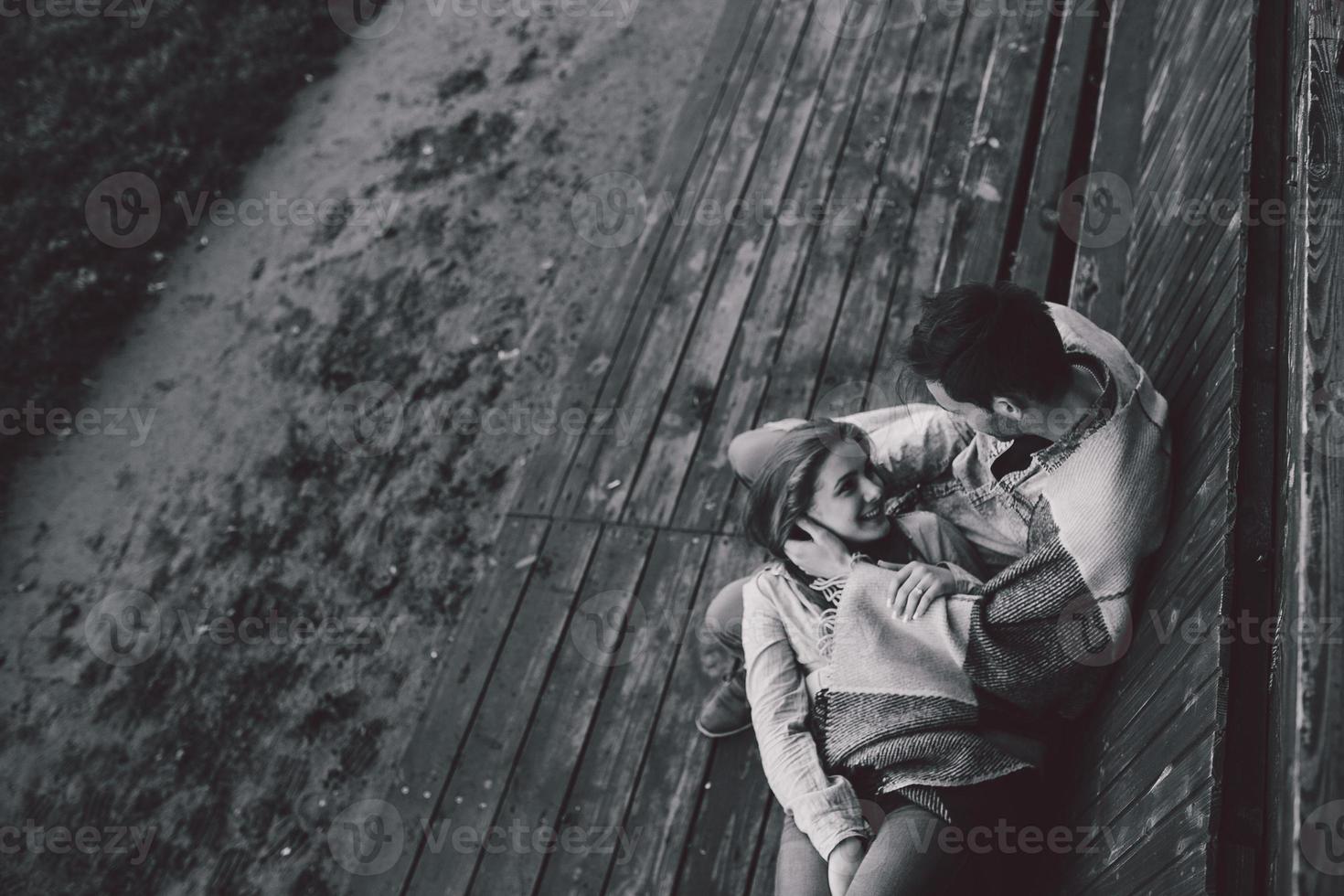 Young couple wrapped in plaid outfocus photo