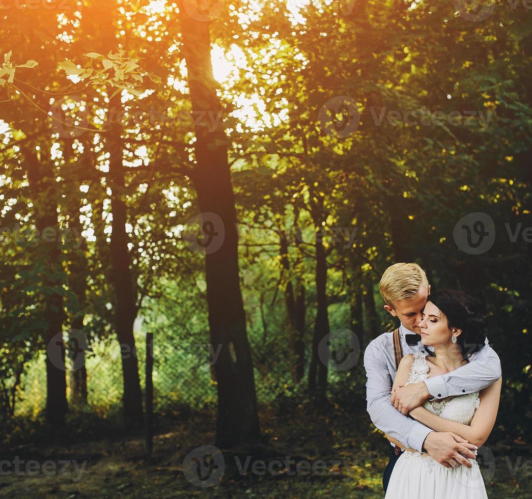 Beautiful wedding couple posing photo