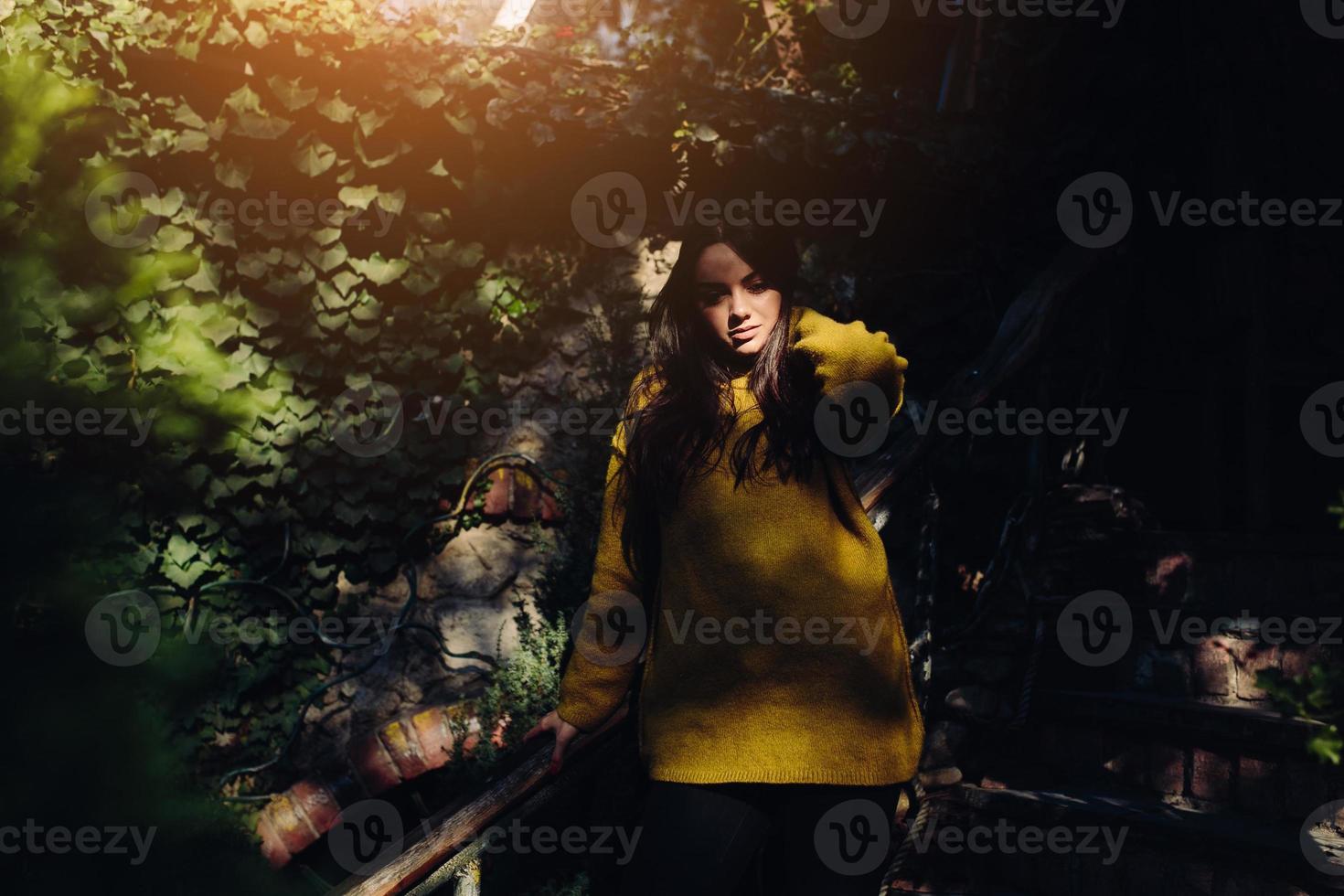 woman posing in the shade of of leaves photo
