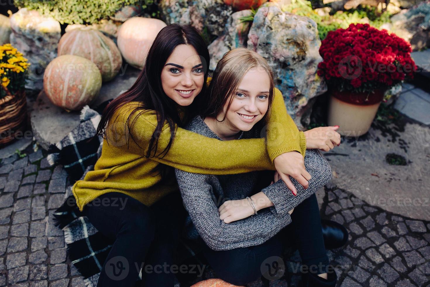 Fashion girls posing on the street photo