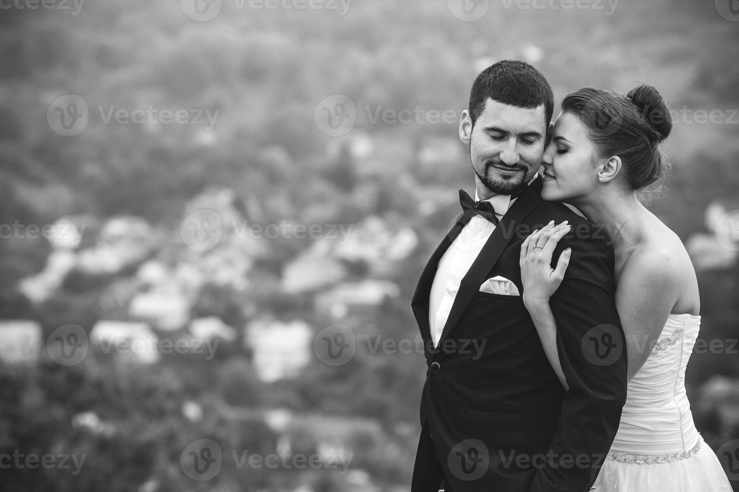 Wedding couple posing for the camera photo