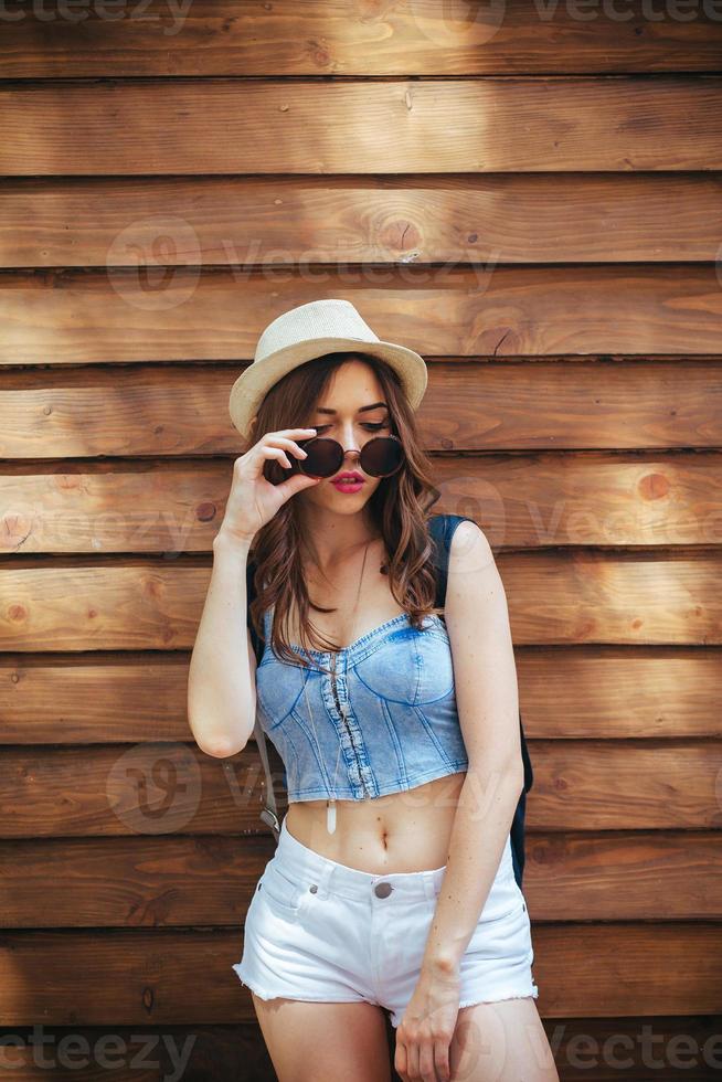 beautiful girl poses for camera in the city photo