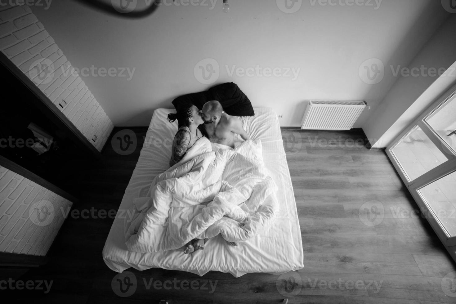 man and woman on the bed photo