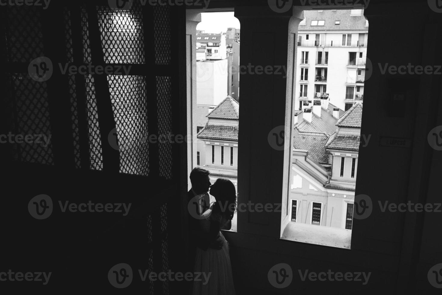 Groom and gorgeous brine in hotel room photo