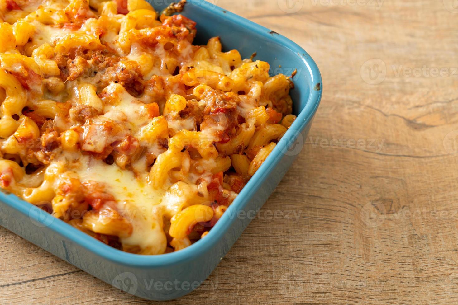 homemade macaroni bolognese with cheese photo