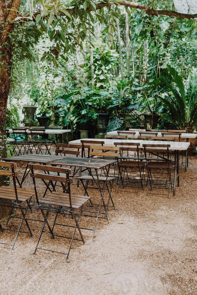 empty wood chair and table in garden photo