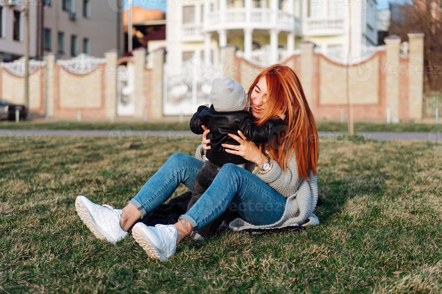 Mother and son on the grass photo