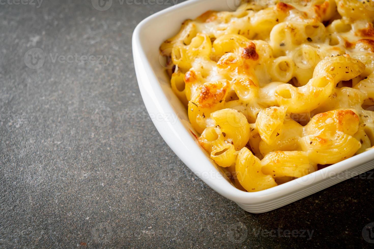 American mac and cheese, macaroni pasta in cheesy sauce photo