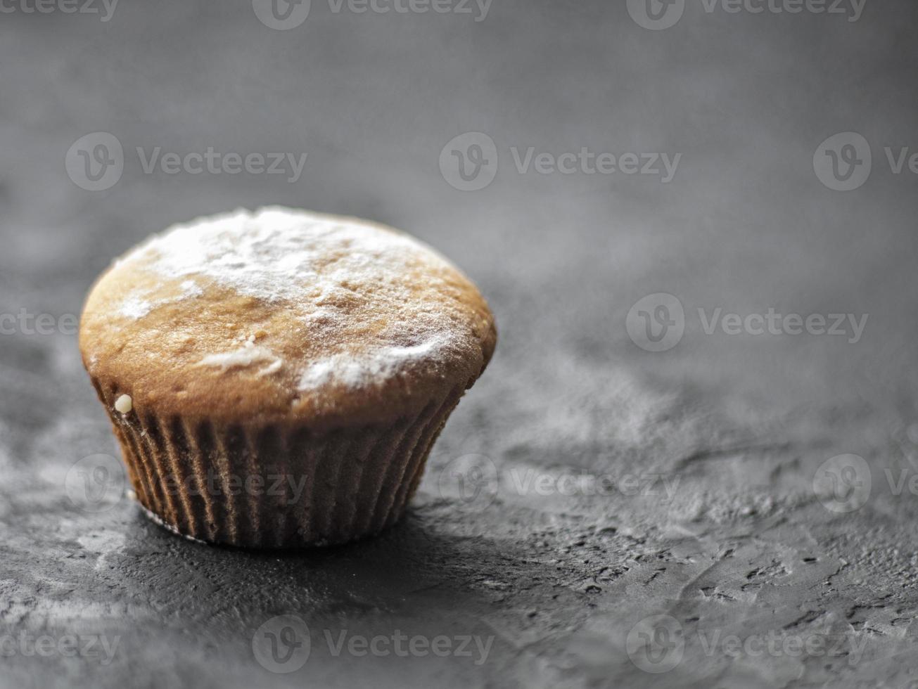 Cakes on a dark stone background photo