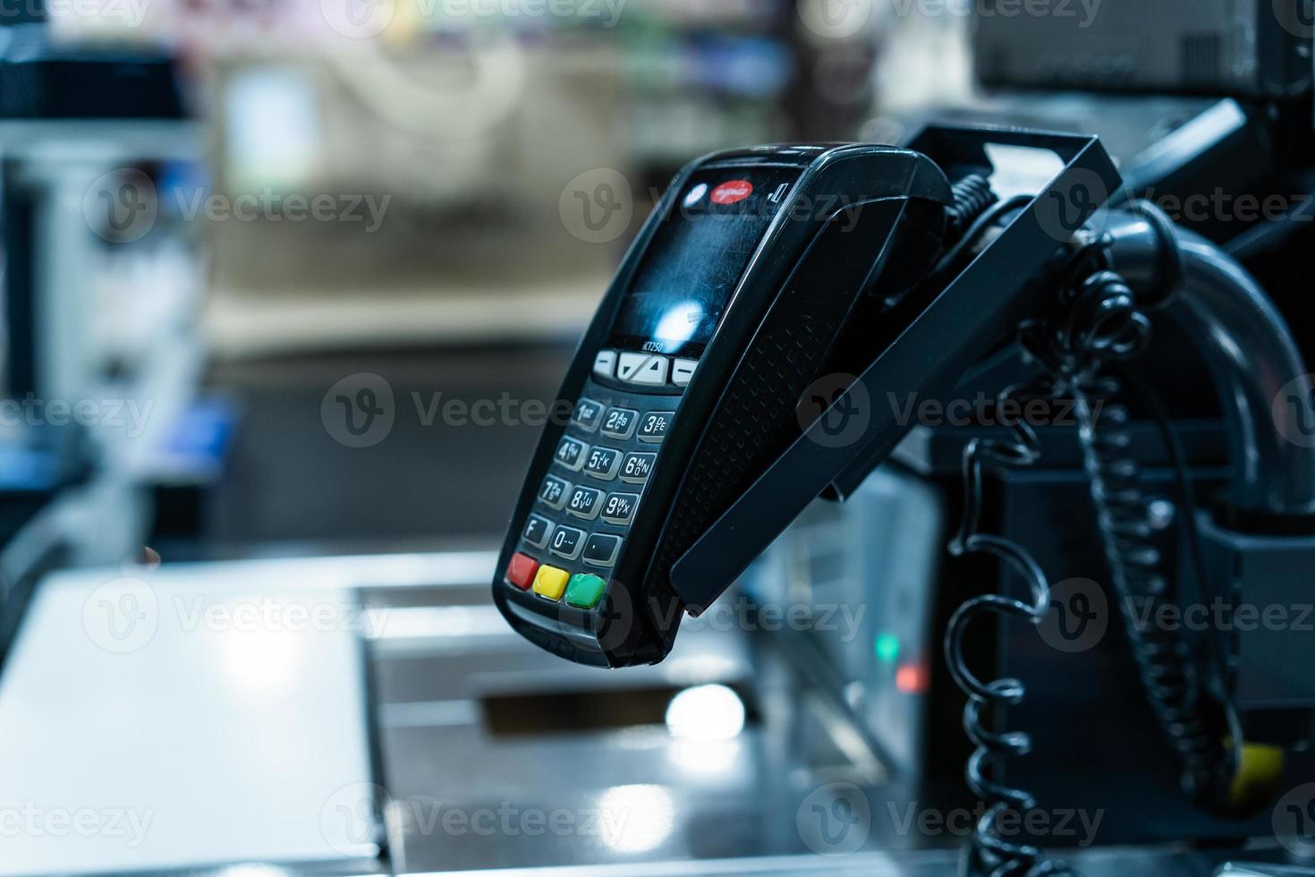 Bank terminal for payment purchases in store by credit cards photo