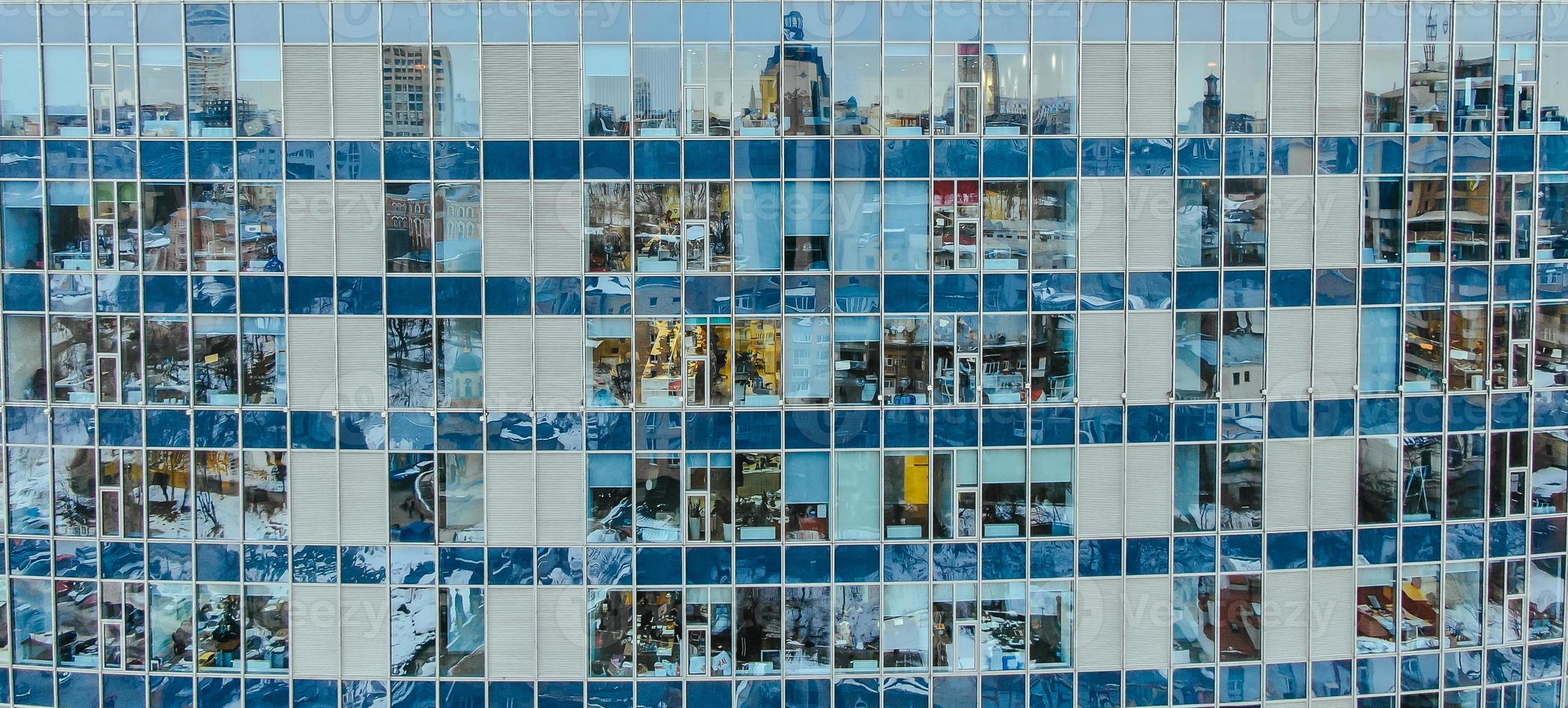 Street reflection on glass steel building facade photo