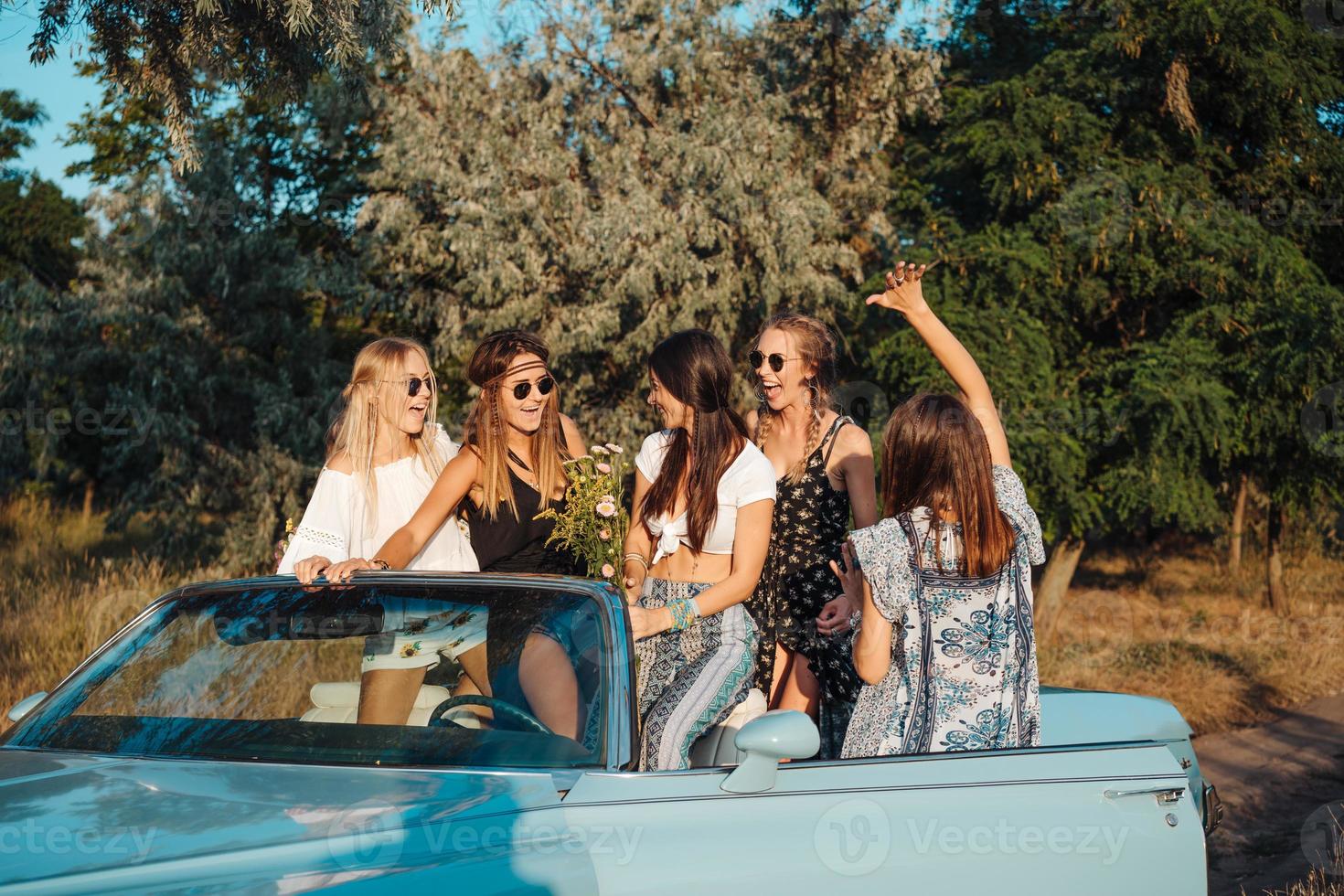 Five girls have fun in the countryside photo