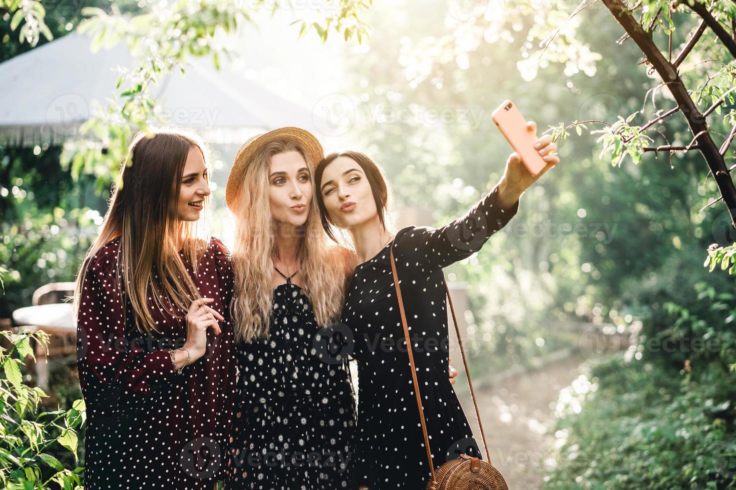 Three girls in a summer park photo