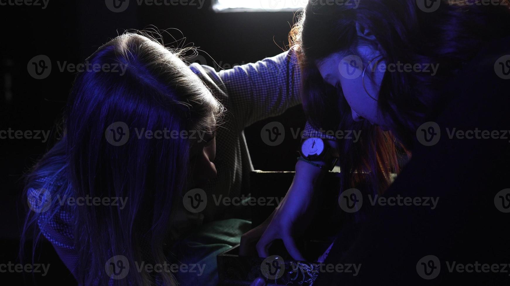 Woman and fortune teller with crystal ball photo