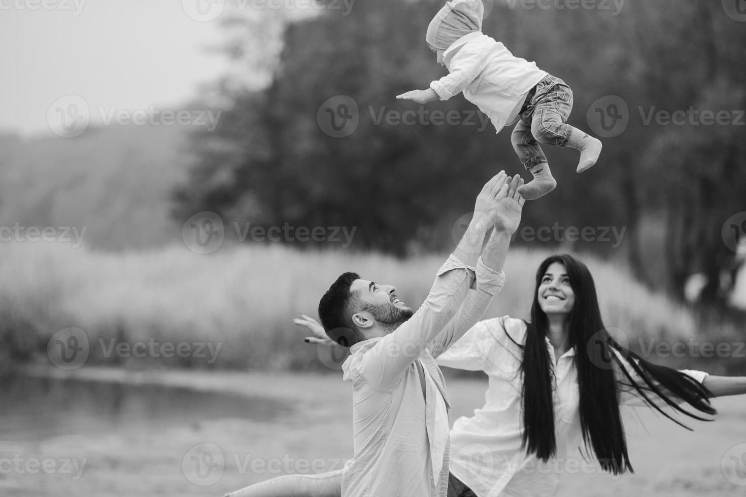 Dad throws up his young son 11525426 Stock Photo at Vecteezy