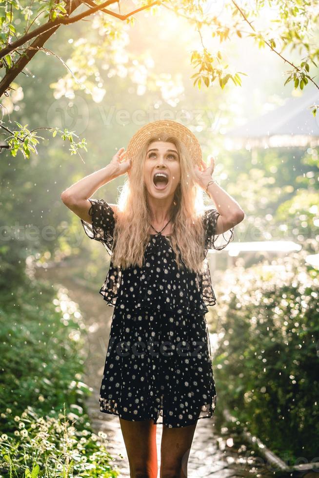 Girl in hat posing on camera photo