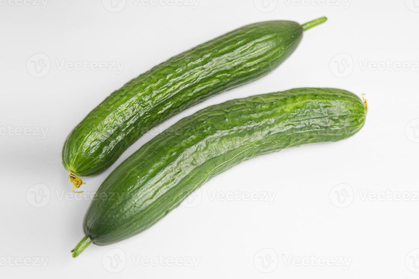 Fresh green cucumber isolated on white background photo