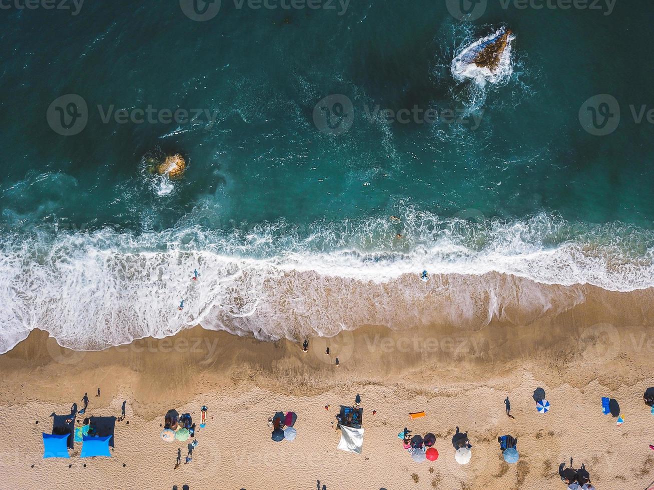 Beach with sun loungers on the coast of the ocean photo