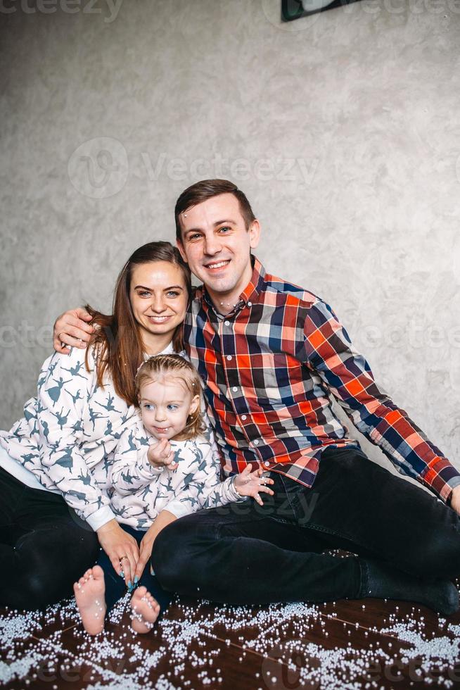 Happy family playing together on the floor photo