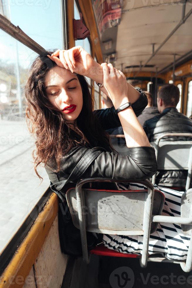 Woman traveling inside the tram photo