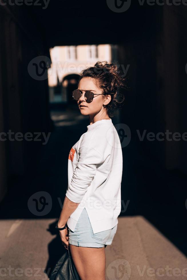 Young girl on the city street photo