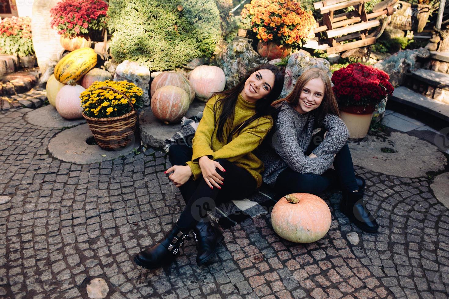 Fashion girls posing on the street photo