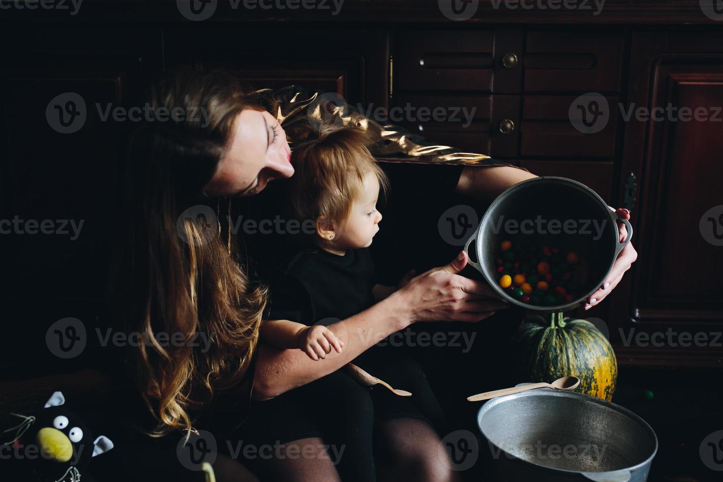 mother and daughter playing together at home photo