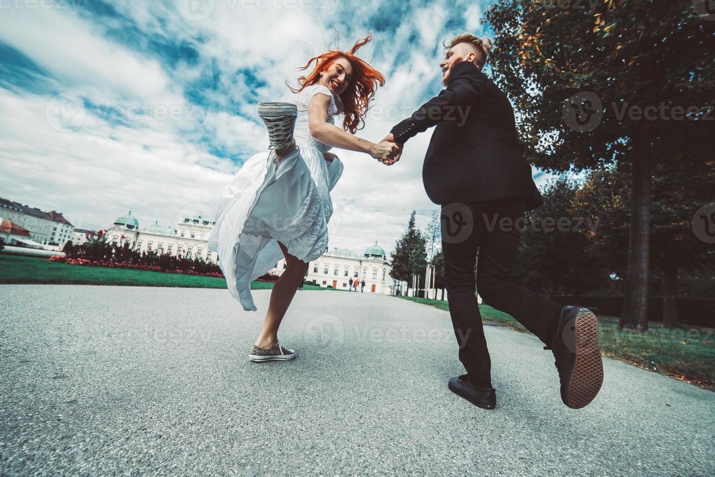 Wedding couple on a walk in the estate of the Belvedere in Vienna photo