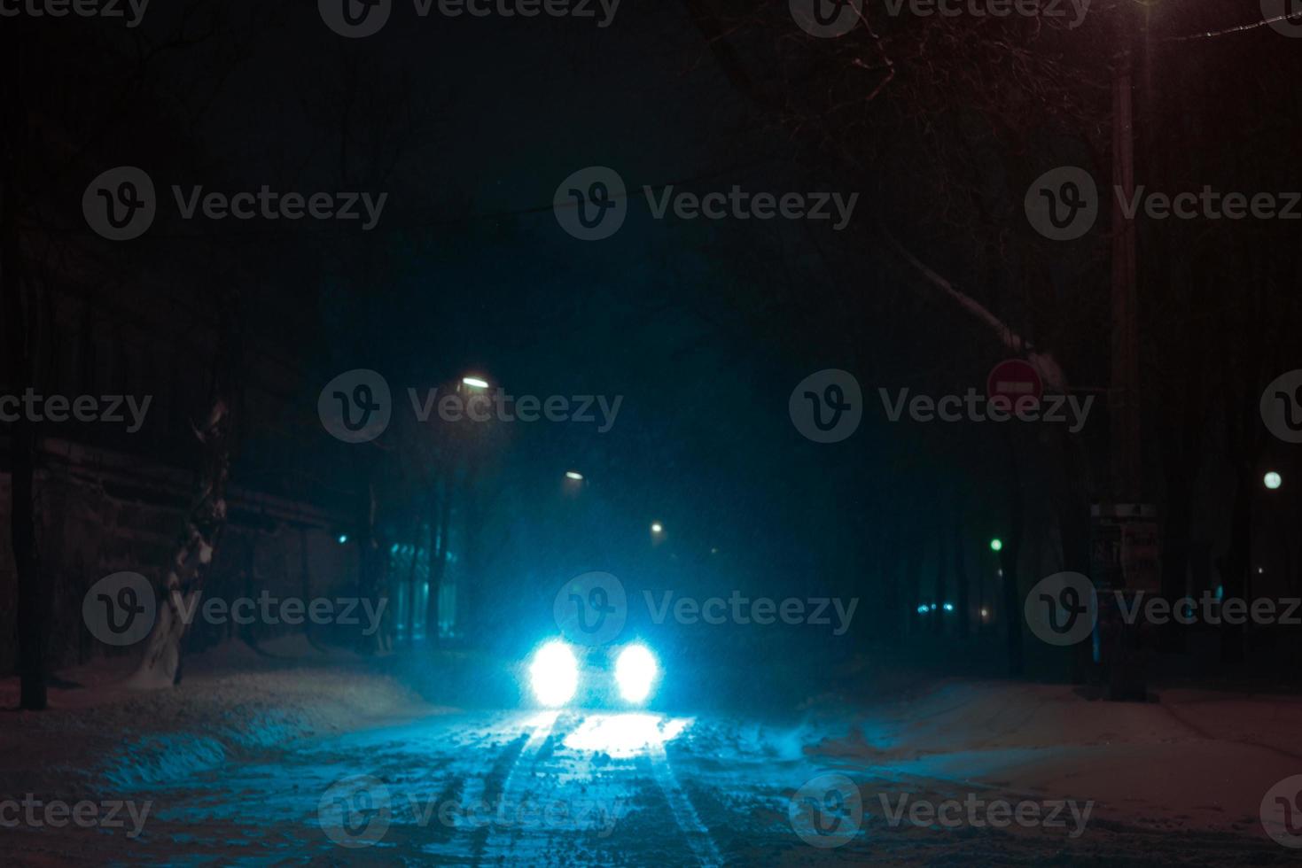 Snow-covered night street photo