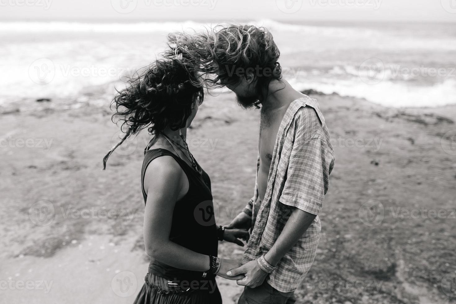 guy and girl have fun on the beach photo