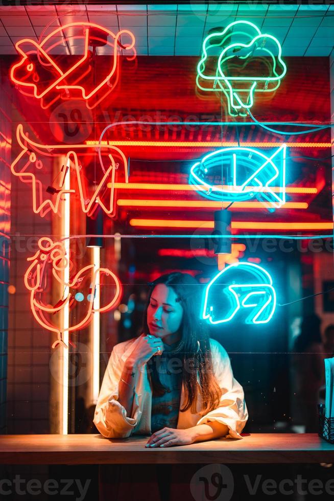 Beautiful girl in a window cafe photo