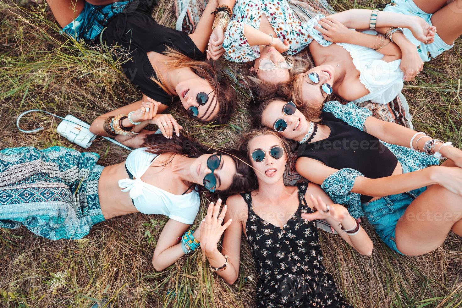 Six girls lie on the grass photo