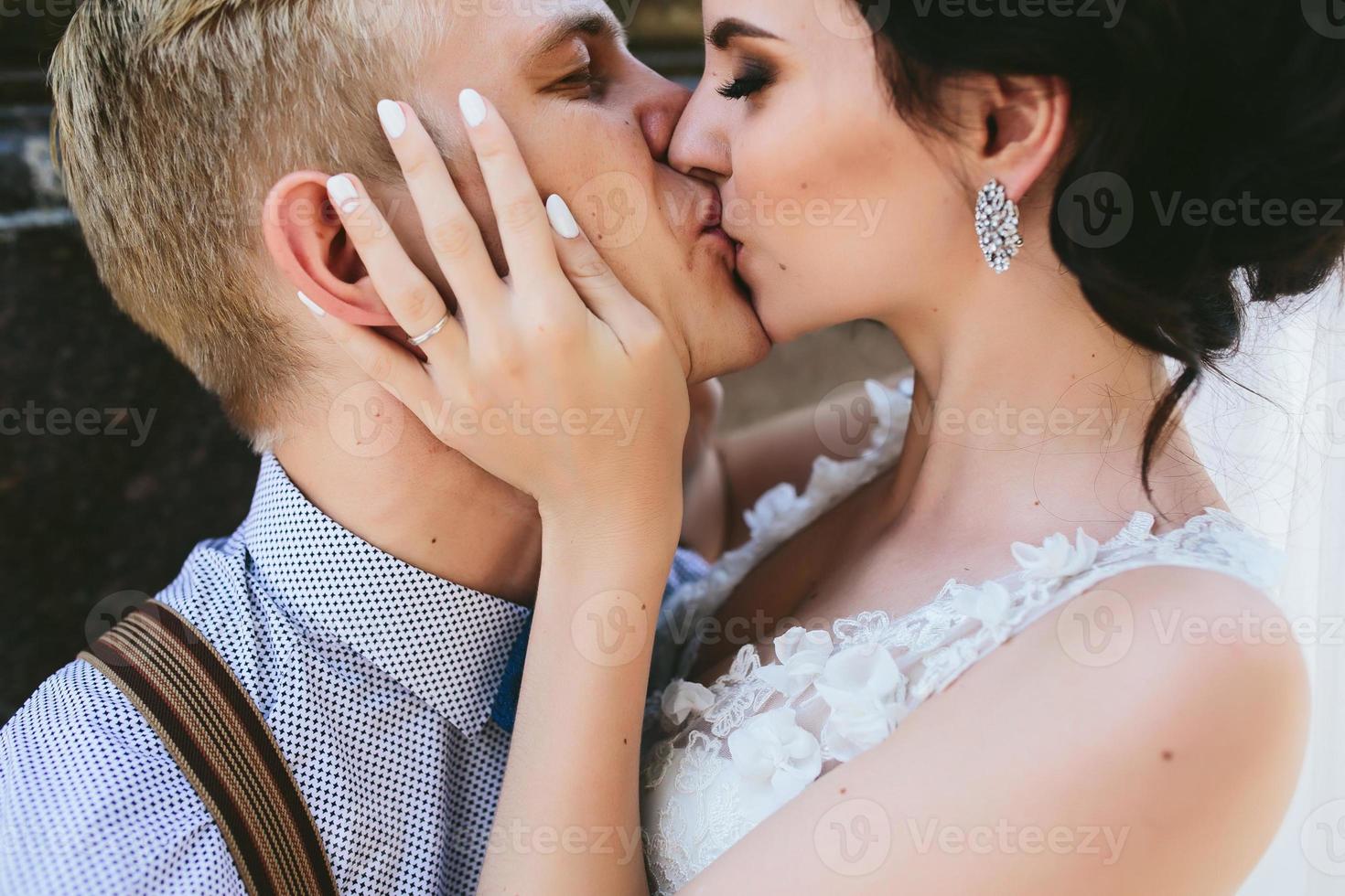 Wedding couple kiss each other photo