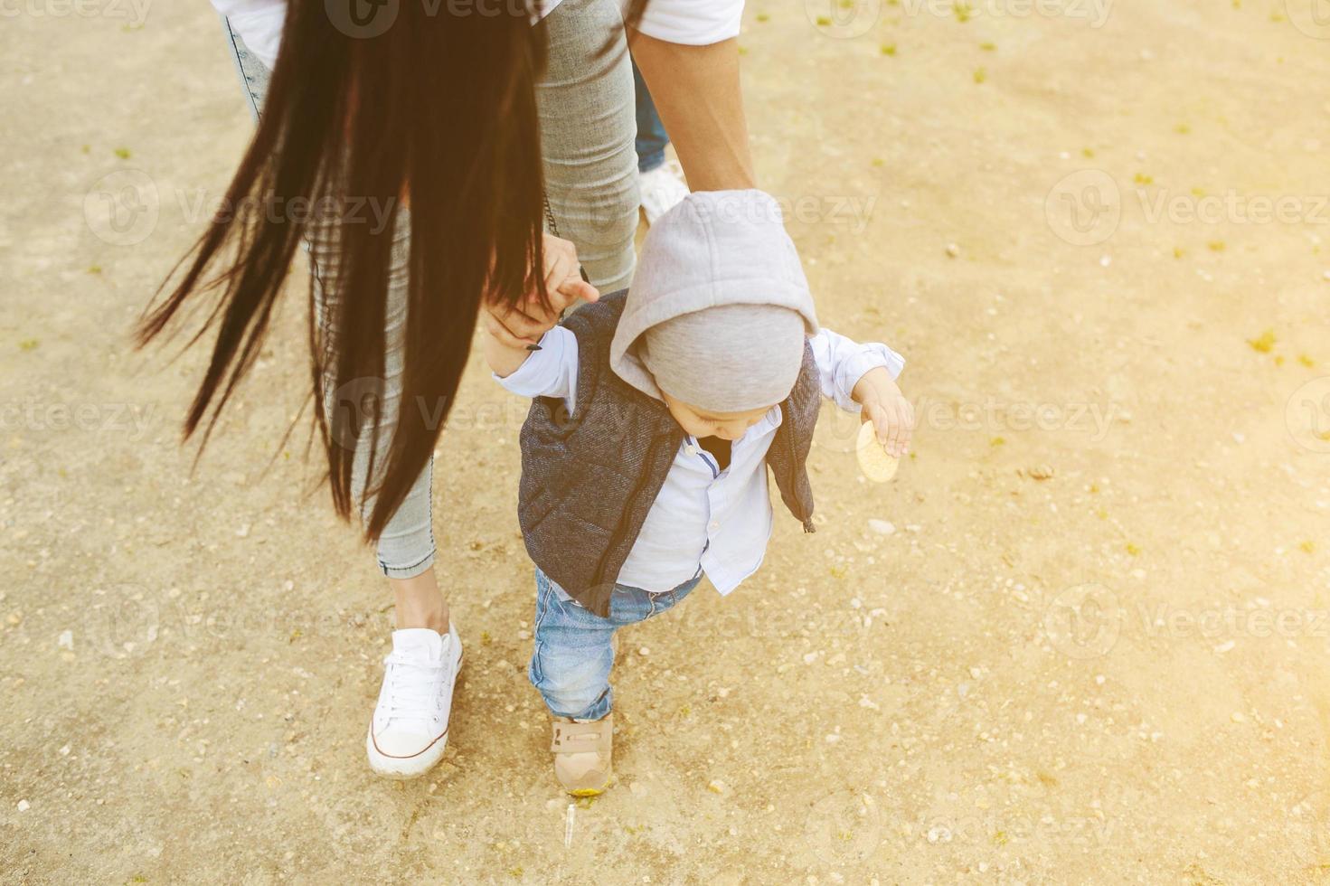 Mom with preteen child walking outdoor photo