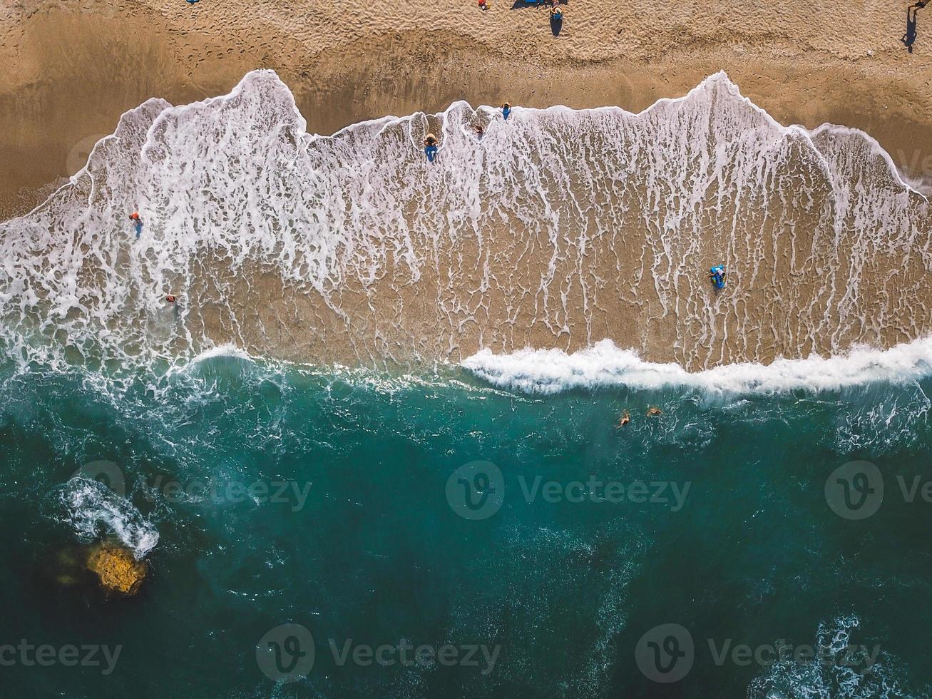 Beach with sun loungers on the coast of the ocean photo
