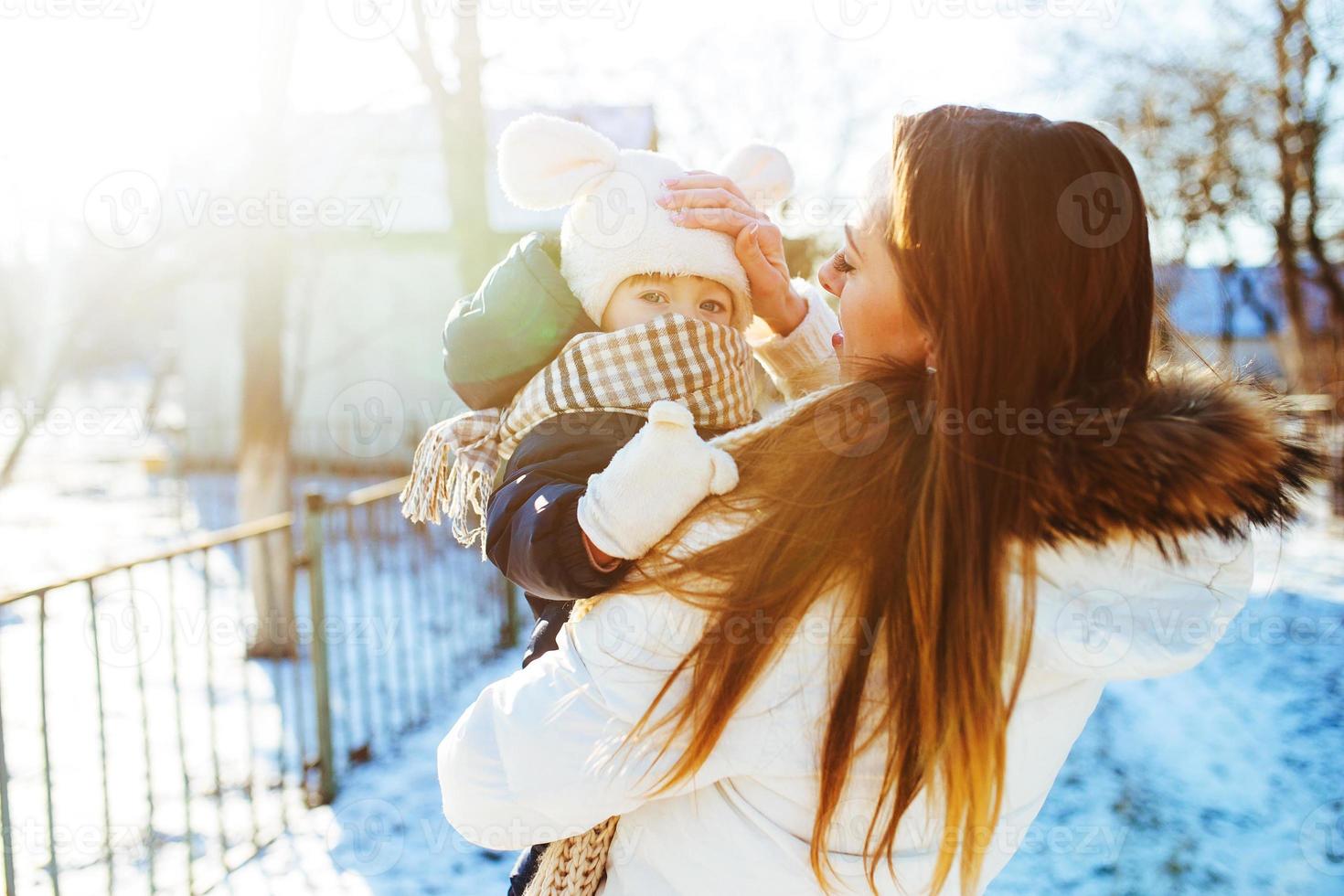 mother and daughter in the snowy countryside photo