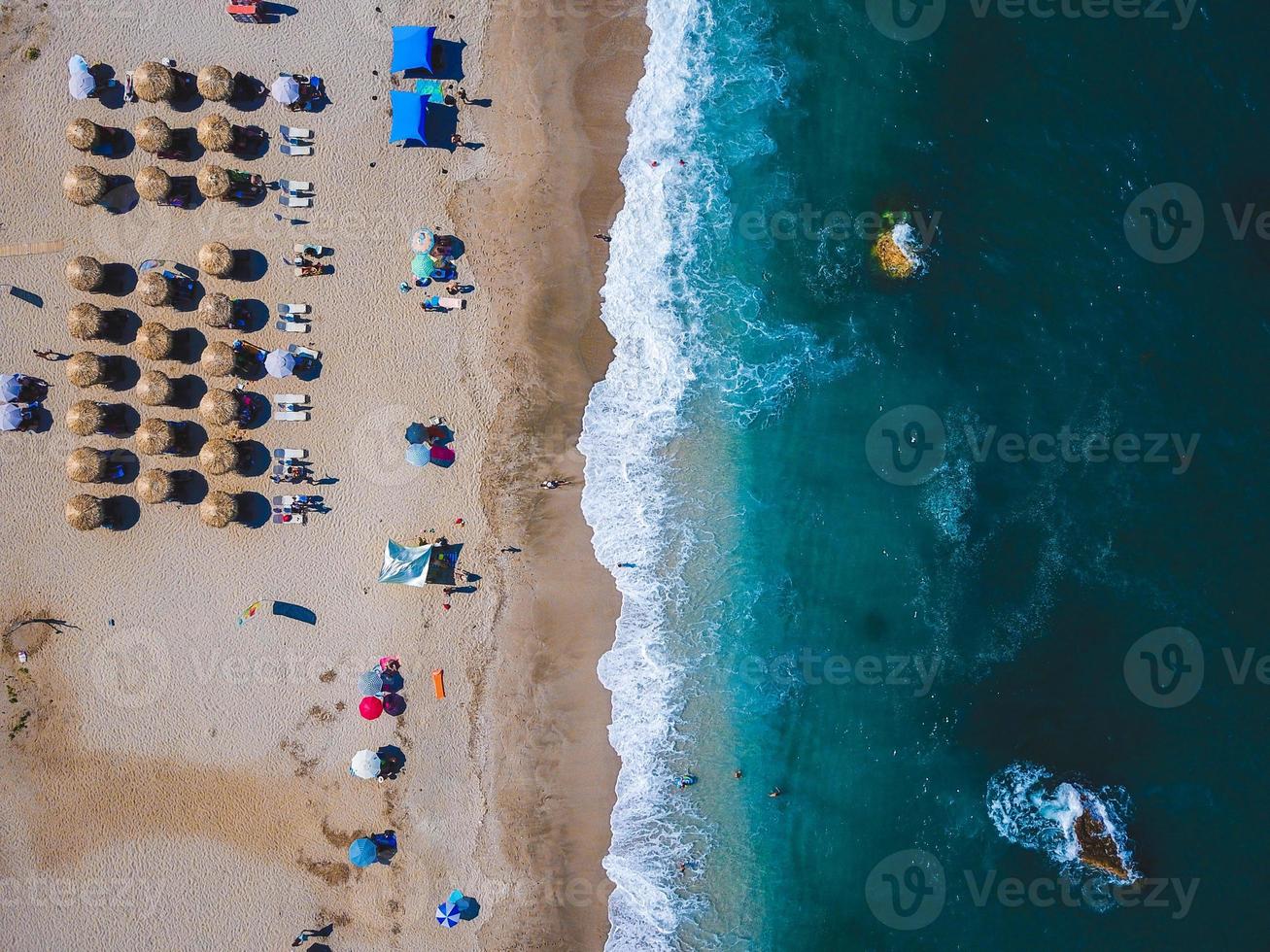 Beach with sun loungers on the coast of the ocean photo