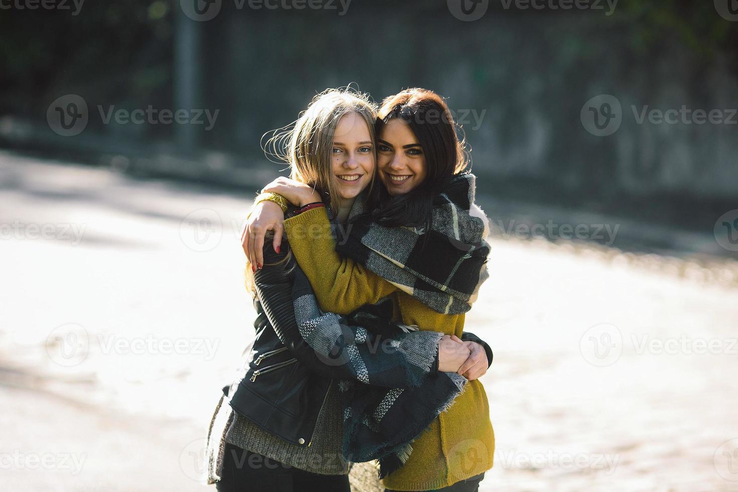 Fashion girls posing on the street photo