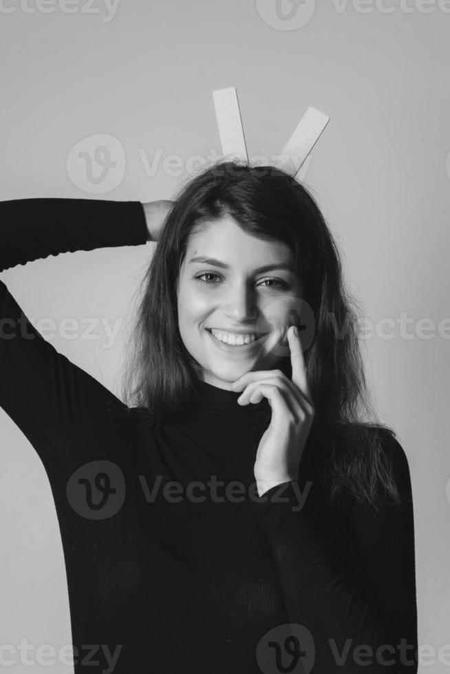 Portrait of a pretty smiling woman posing isolated photo