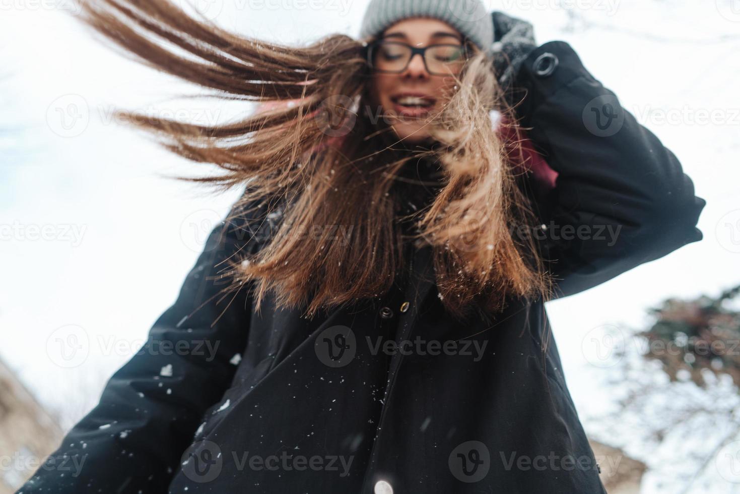 Young beautiful woman at winter city photo